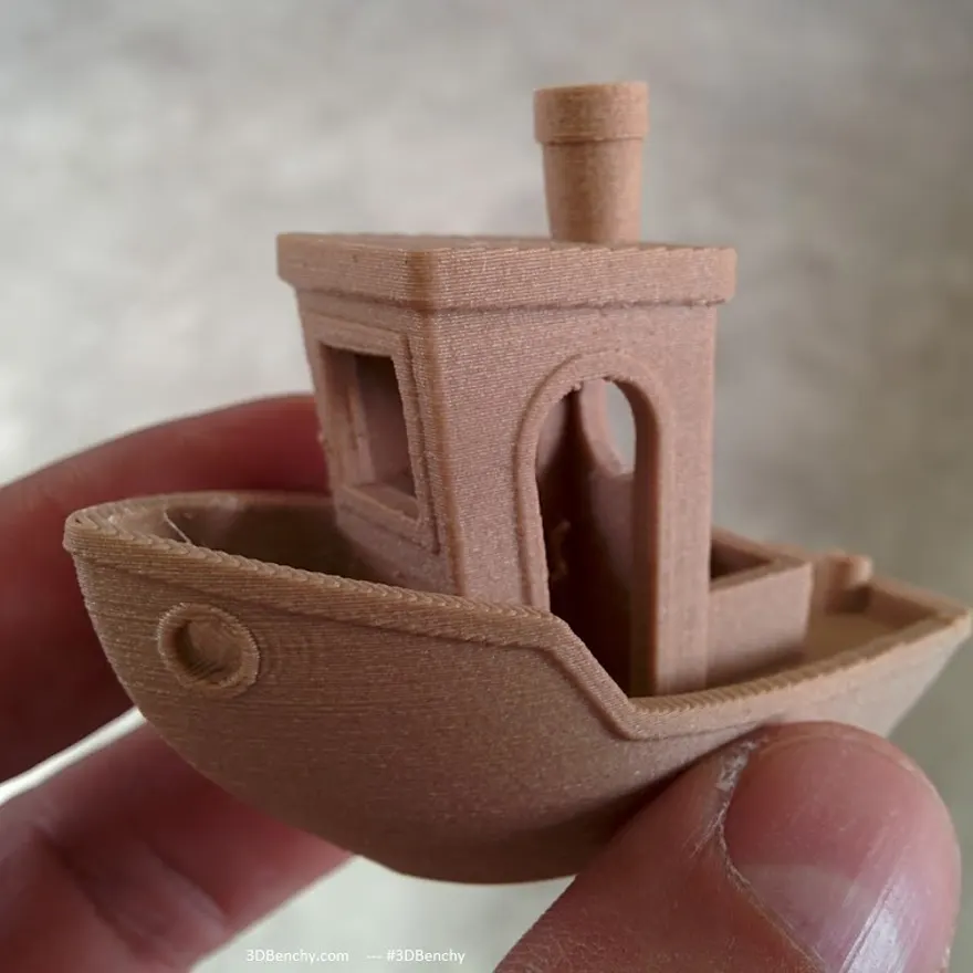 A model boat printed in wood-fibre filament with a visible grain